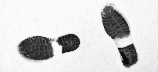 Human footprints in white snow. Footprints in the snow