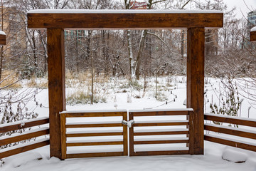 Snowbound deserted city park in the cold winter
