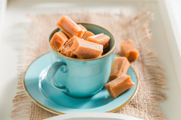 Delicious toffee cake on blue porcelain with fudge bars