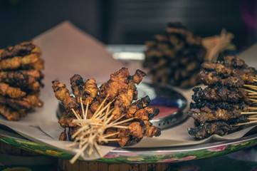 Traditional barbecue on the the local market in Chinatown, Kuala lumpur. Street food  in Kuala lumpur, Malaysia