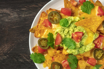 Nachos with cheese, traditional Mexican snack, with copyspace