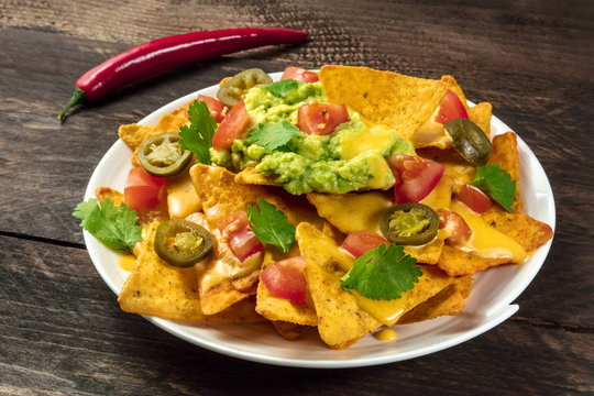 Nachos with cheese and hot peppers, traditional Mexican snack