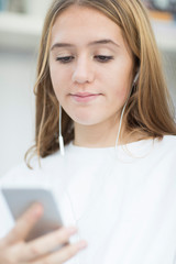 Teenage Girl Streaming Music From Mobile Phone