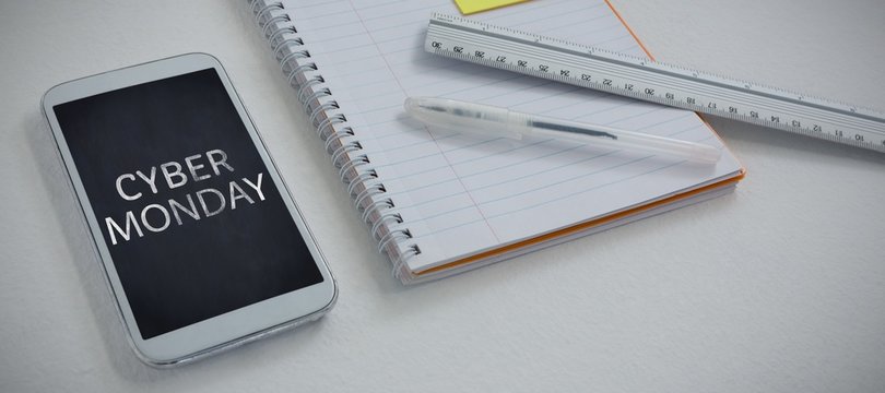 Composite image of mobile phone and stationery on white