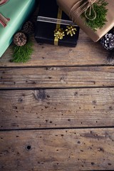 Gift boxes on wooden plank