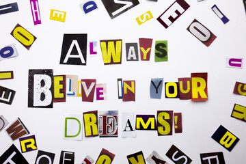 A word writing text showing concept of Always Believe in Your Dreams made of different magazine newspaper letter for Business case on the white background with copy space