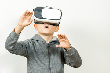 Boy with a headset of virtual reality. Innovative technology. On an white background