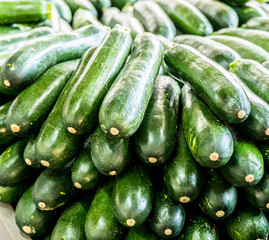 Zucchini or courgette in the wooden crate.