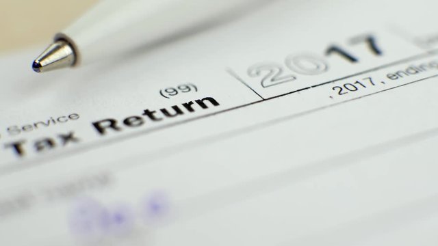 Individual Income Tax Return Form 1040 with Pen in 2017 in USA