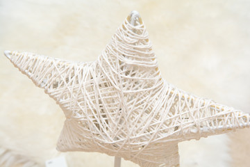 White Christmas star on a blurred white background