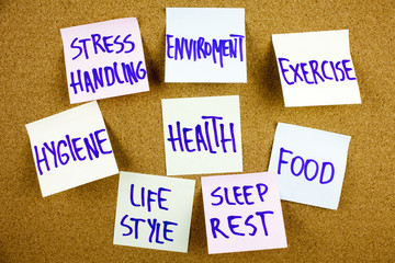 inscription health concept - word cloud or circle of contributing factors, colorful sticky notes on cork bulletin board in black ext on a sticky note pinned to a cork notice board