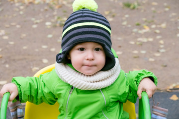 Portrait of adorable baby on playground