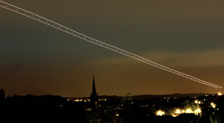 Obraz premium Long exposure airplane landing 