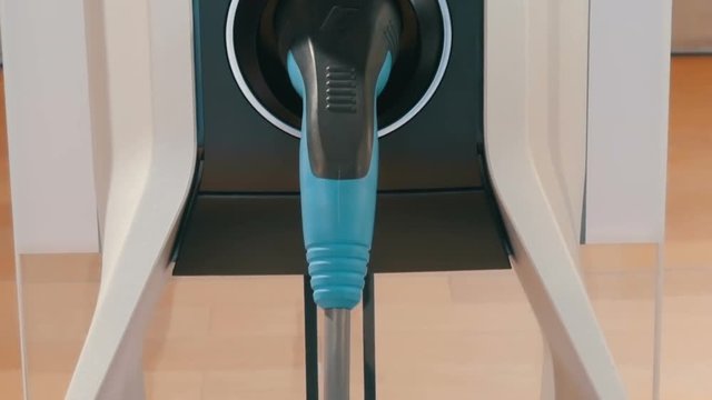 View on the column for refueling electric vehicles and cable. Ecologically clean transport. Portable refueling for electric vehicles