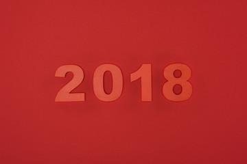 close up view of red 2018 sign isolated on red