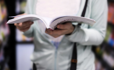 Young woman reading book