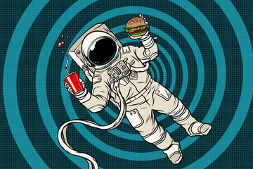 Astronaut in zero gravity with fast food © studiostoks
