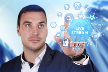 Business, Technology, Internet and network concept. Young businessman working on a virtual screen of the future and sees the inscription: Live stream