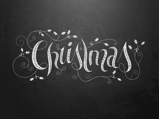 Ornate hand lettering &laquo; Christmas &raquo; on dark grunge background