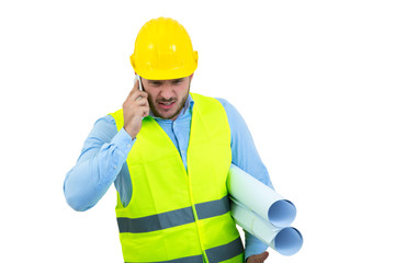 Angry upset young construction engineer yeling at the phone