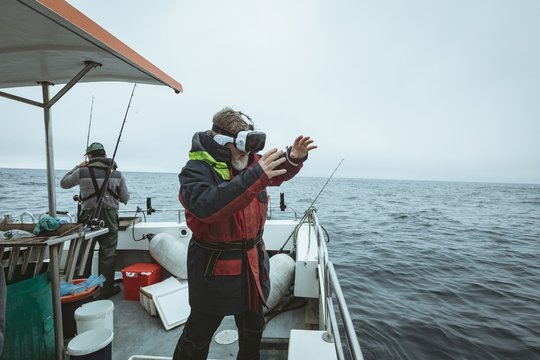 Fisherman using virtual reality headset