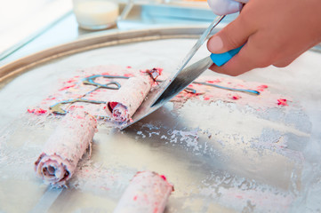 Fresh fried ice cream, ice roll - Preparation of fresh fruit dessert, fried ice cream, organic tasty bio-rolls, healthy food. 