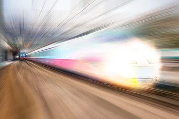 Obraz na płótnie Canvas Modern high speed train on a clear day with motion blur