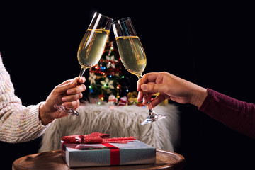 Happy Relaxing and celebrating at party, Two champagne glasses and sparkle, Christmas tree ornament on the background
