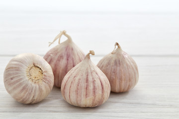 Fresh healthy garlic on white table