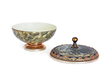 Open casket. Round old casket on a white background. Casket for candy. Old dishes.