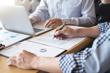 Young businessteam working with new startup project. discussing the charts and graphs showing the results at meeting. Business accounting and financial concept