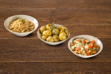 Portion Fried potato, vinaigrette and flour in white bowl. Concept of health rustic food.