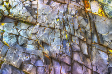 Multicolored rock wall from bottom sediments