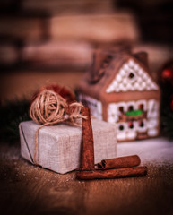 Obraz na płótnie Canvas Christmas present on the background of a gingerbread house