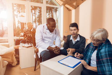 Fototapeta premium An elderly woman bequeaths her house to a young man.