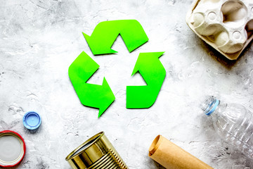 environment concept with recycling symbol on stone background to