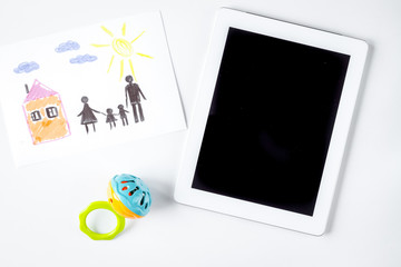 Adoption concept with tablet and drawing on white background top