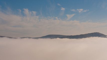 misty frosty snow winter landscape in nature, mist flowing, foggy winter landscape from Julianus tower 