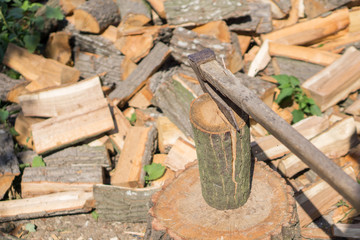 Close up of a pile of cracked wood in a rural yard. Shallow depth of field.