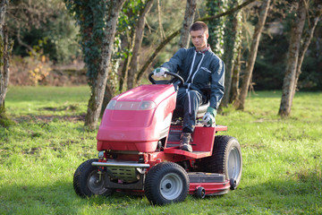 Young man mowing