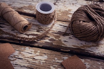 Crafts material and handmade christmas tree on wooden plank