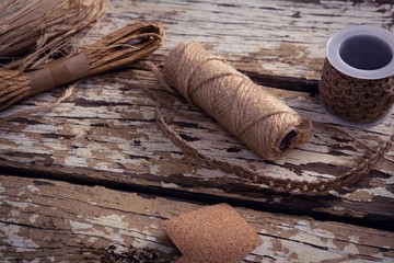 Crafts material and handmade christmas tree on wooden plank