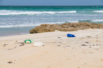 Fototapeta na wymiar Plastic rubbish brought in on the Atlantic Ocean tide discarded on Santa Maria Beach, Boa Vista, Cape Verde