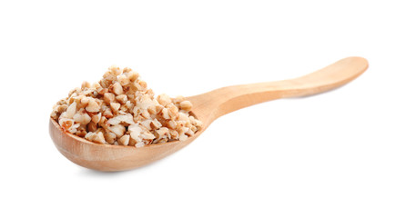 Spoon with cooked buckwheat on white background