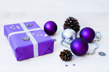 New Years and Christmas decorations, balls, gifts, boxes, packaging, handmade toys, preparing for the holiday. Wooden background flat lay