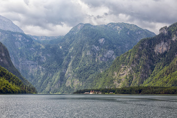 Konigssee near German Berchtesgaden surrounded with mountains raising vertical out of the lake