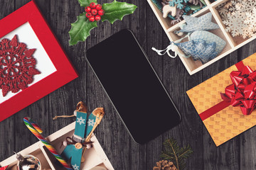 Black smartphone in a christmas scene