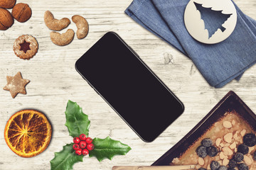 Black smartphone in a christmas scene