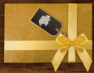 A gift box with Gabon drawn on a label with chalk.(series)