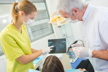 Fototapeta premium Busy dentist with a patient